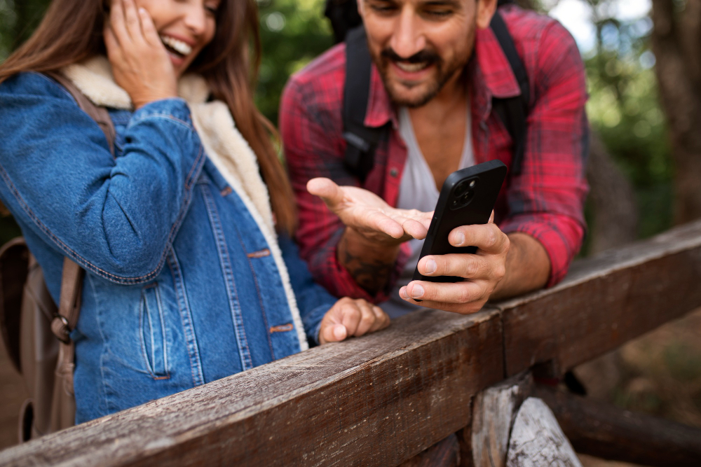 Happy couple seeing a message
